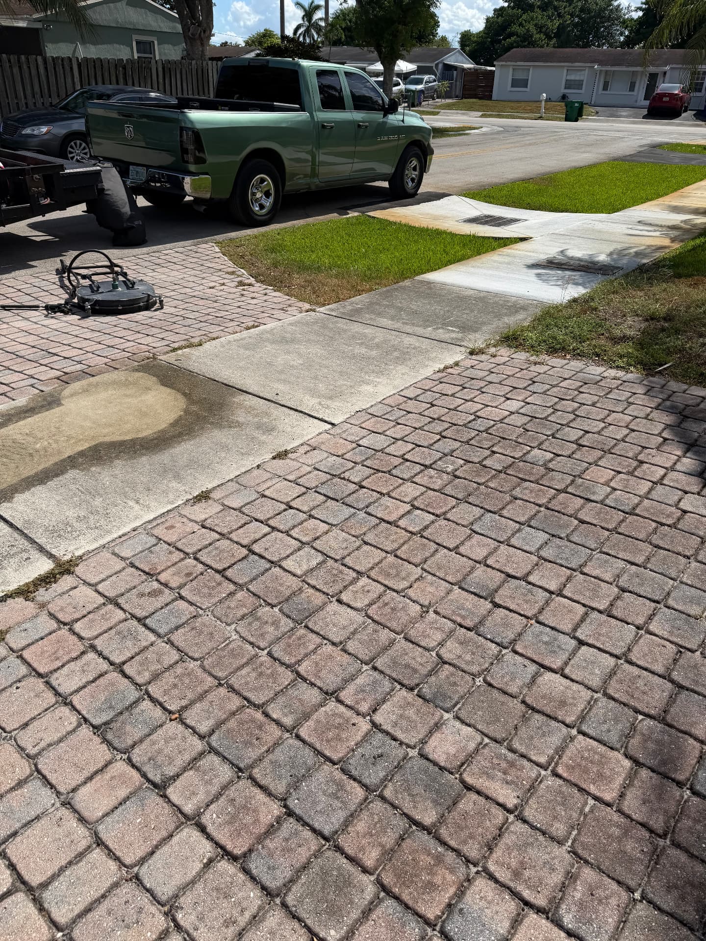 Paver driveway and concrete apron cleaned during a job